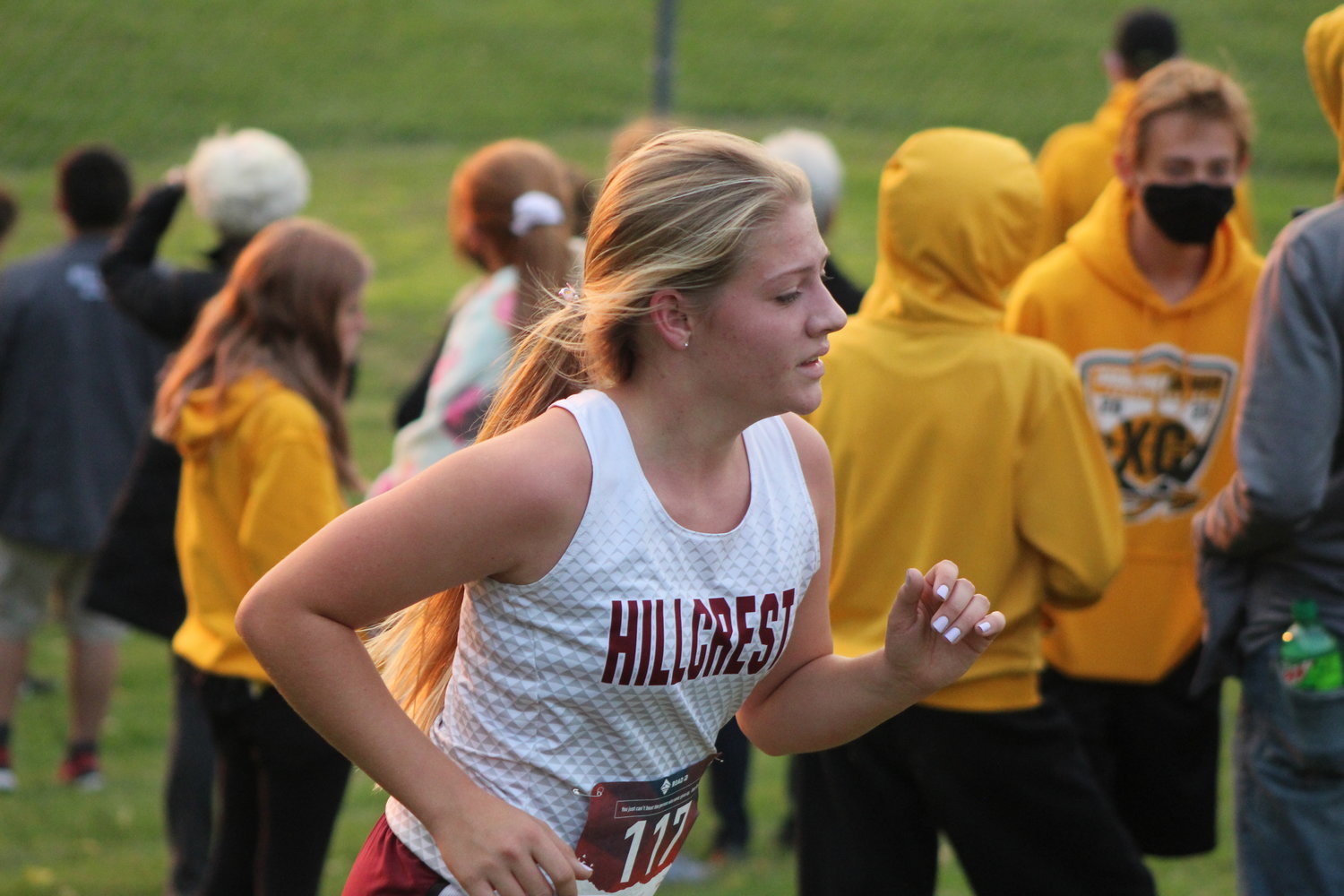 Kennedy Roth of Hillcrest Academy heads up a hill and toward the finish line in Monday’s girls varsity race.