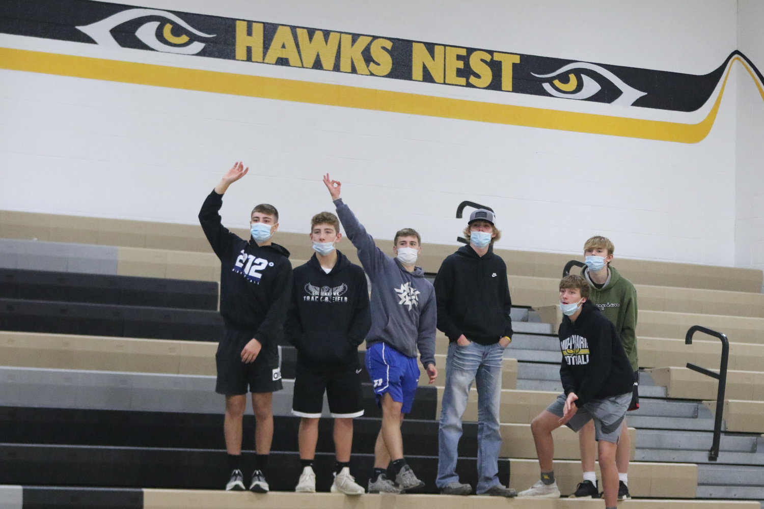 A small student section watches first half action during Mid-Prairie's scrimmage with Mediapolis in Wellman on Saturday, November 21.