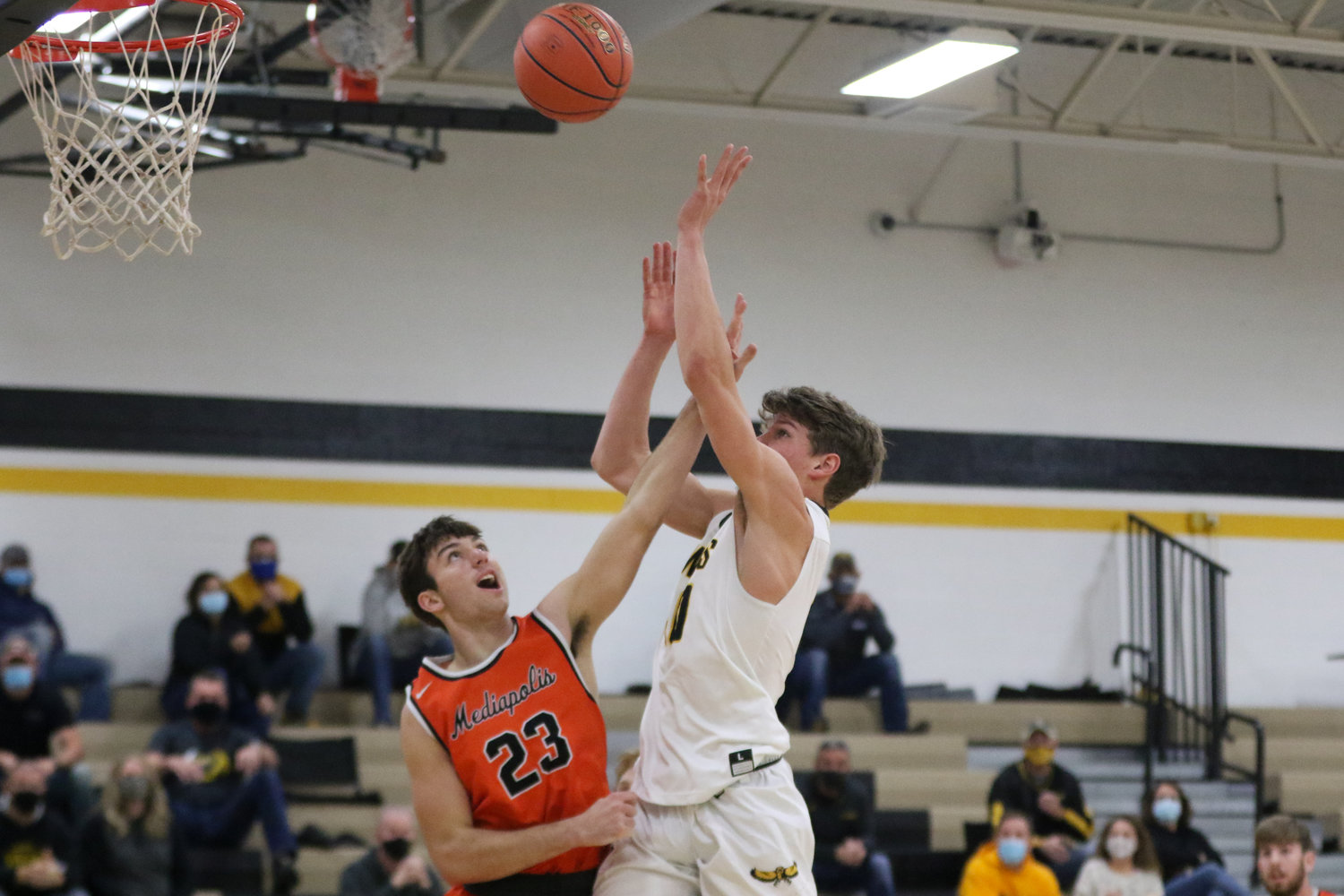 Mid-Prairie forward Carter Harmsen shoots over a Bulldog defender during the first quarter of a scrimmage with Mediapolis in Wellman on Saturday, November 21.