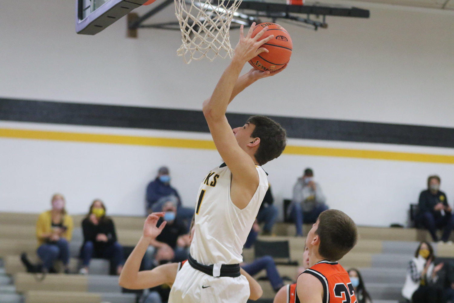 Ethan Kos puts up a shot in the paint during the first quarter of a scrimmage with Mediapolis in Wellman on Saturday, November 21.