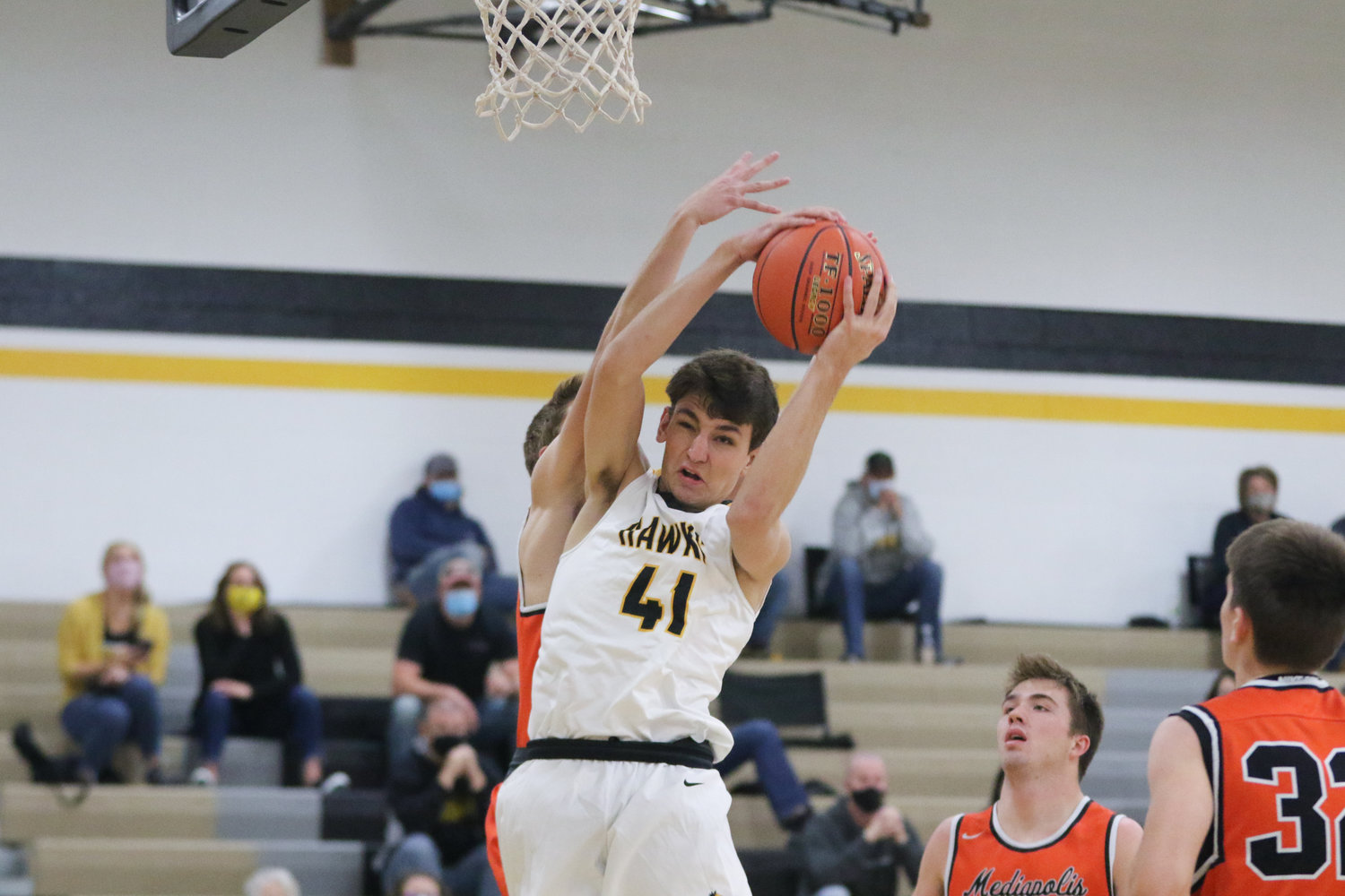 Mid-Prairie forward Ethan Kos grabs a rebound during the first quarter of a scrimmage with Mediapolis in Wellman on Saturday, November 21.