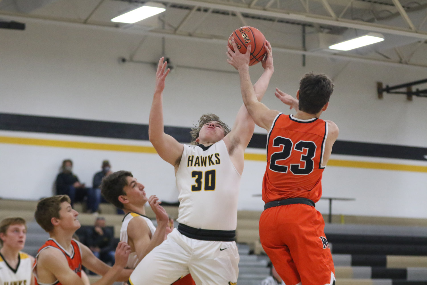 Mid-Prairie's Justice Jones fights for a rebound during the first quarter of a scrimmage with Mediapolis in Wellman on Saturday, November 21.