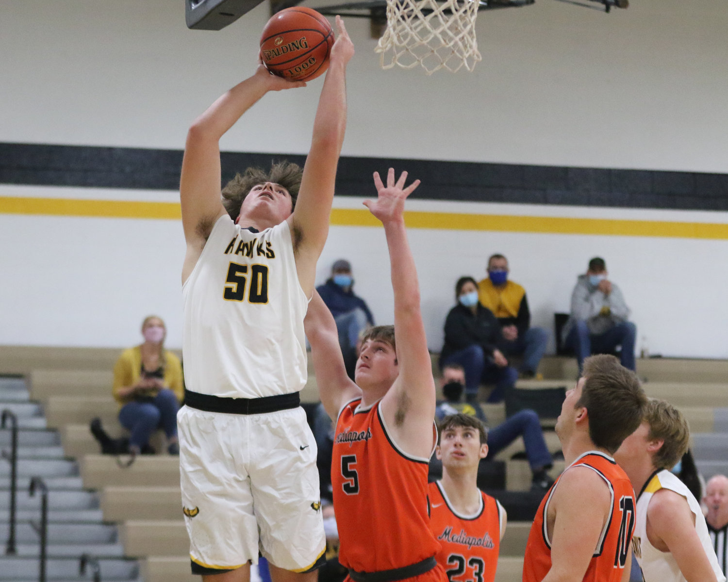 Aidan Rath puts up a shot in the paint during the first quarter of a scrimmage with Mediapolis in Wellman on Saturday, November 21.