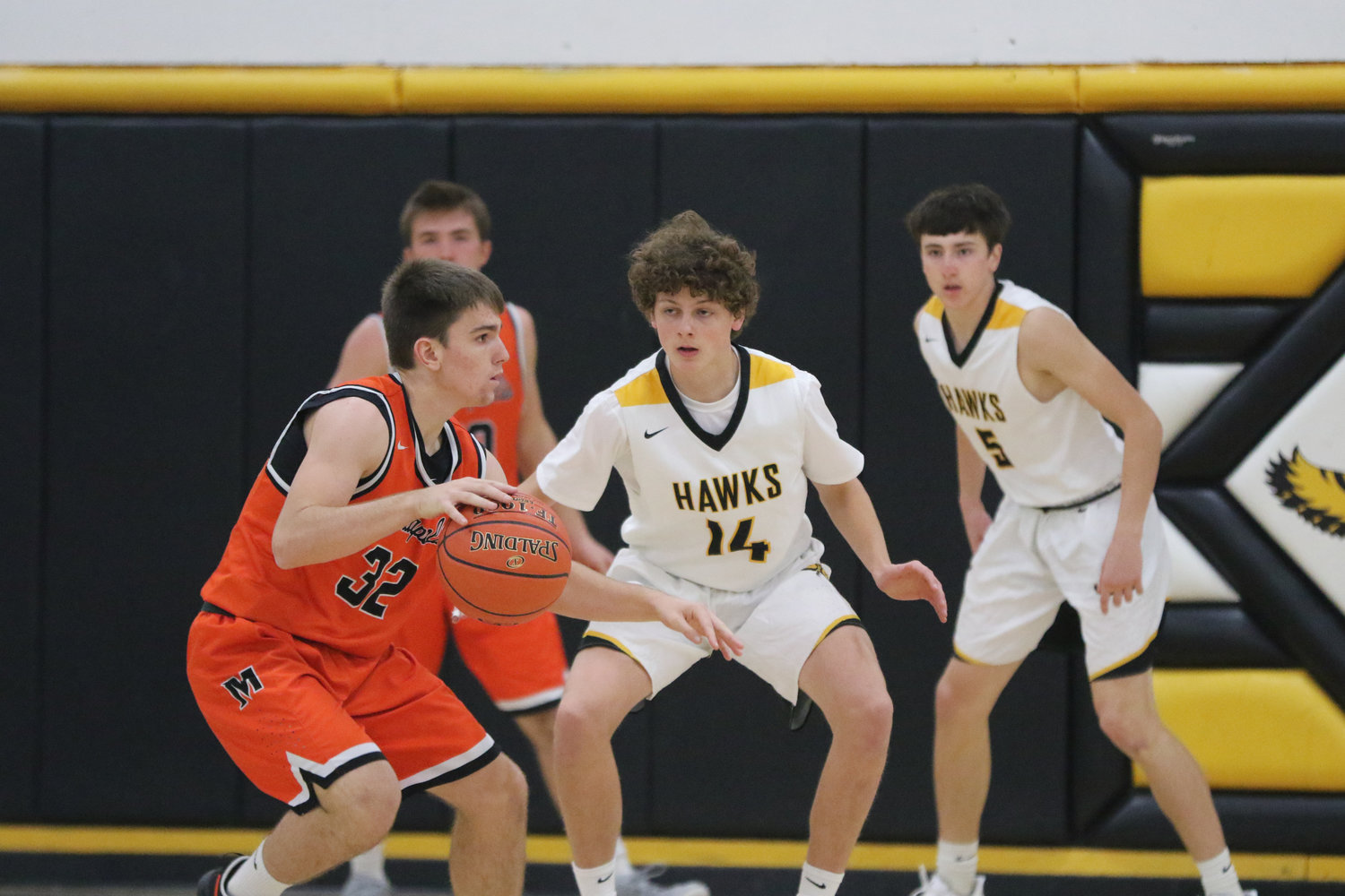 Mid-Prairie guard Jackson Pennington (14) defends Mediapolis' Ben Egan during the first quarter of a scrimmage in Wellman on Saturday, November 21.