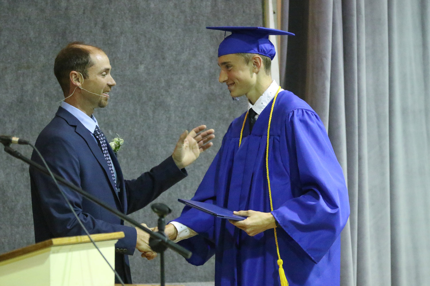 Jamison Stutzman receives his diploma during Pathway Christian School's graduation ceremony on May 16, 2021.