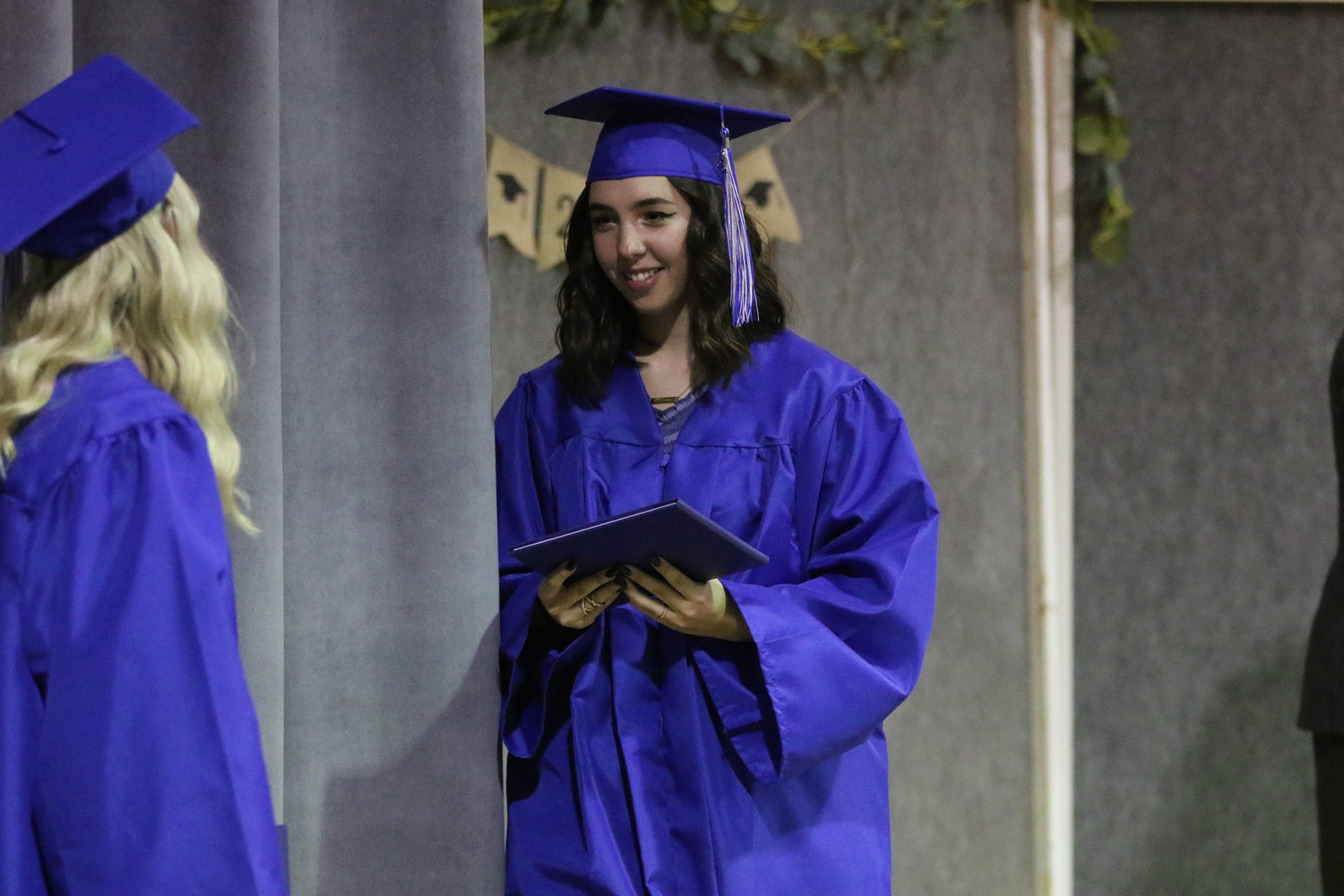 Brooke Schwartz walks across the stage with her diploma during Pathway Christian School's graduation ceremony on May 16, 2021.