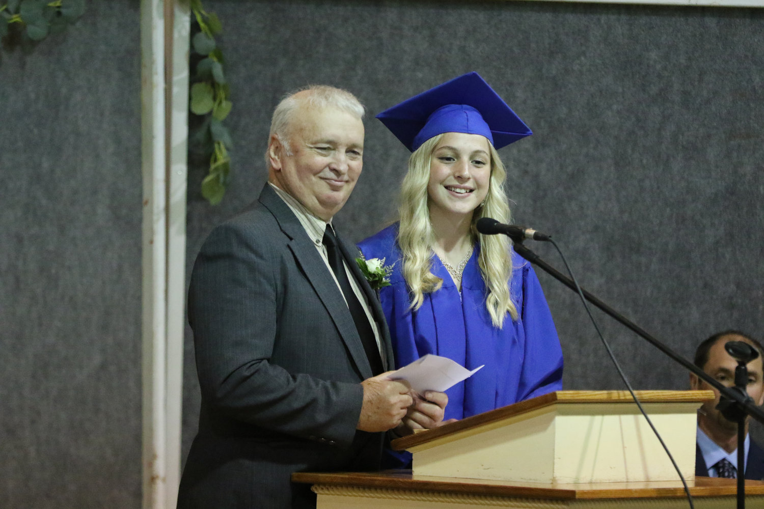 Mariah Miller presents the class gift to principal Lawrence Schlabach during Pathway Christian School's graduation ceremony on May 16, 2021.