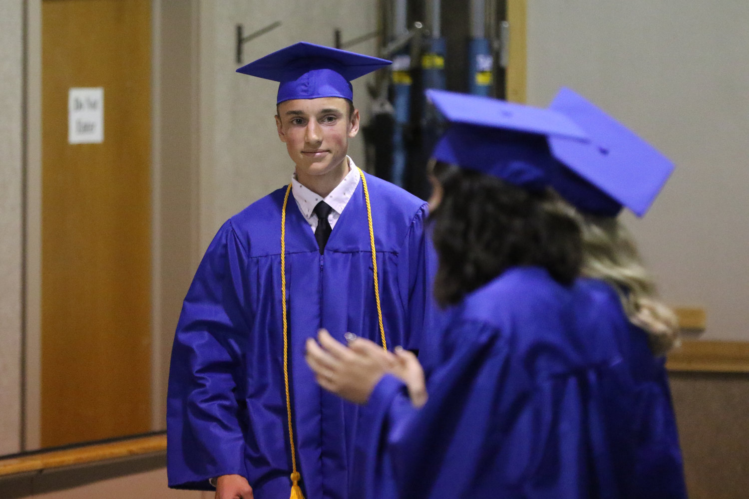 Valedictorian Jamison Stutzman returns to his seat after speaking during Pathway Christian School's graduation ceremony on May 16, 2021.
