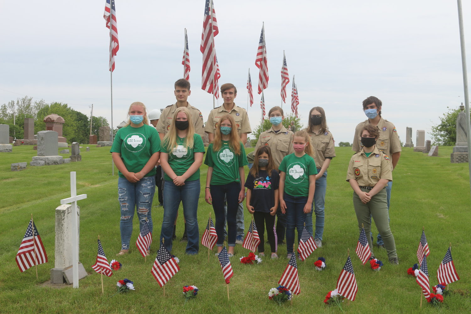 The Riverside Boy Scouts, Cub Scouts and Girl Scouts placed flowers in remembrance of all wars.