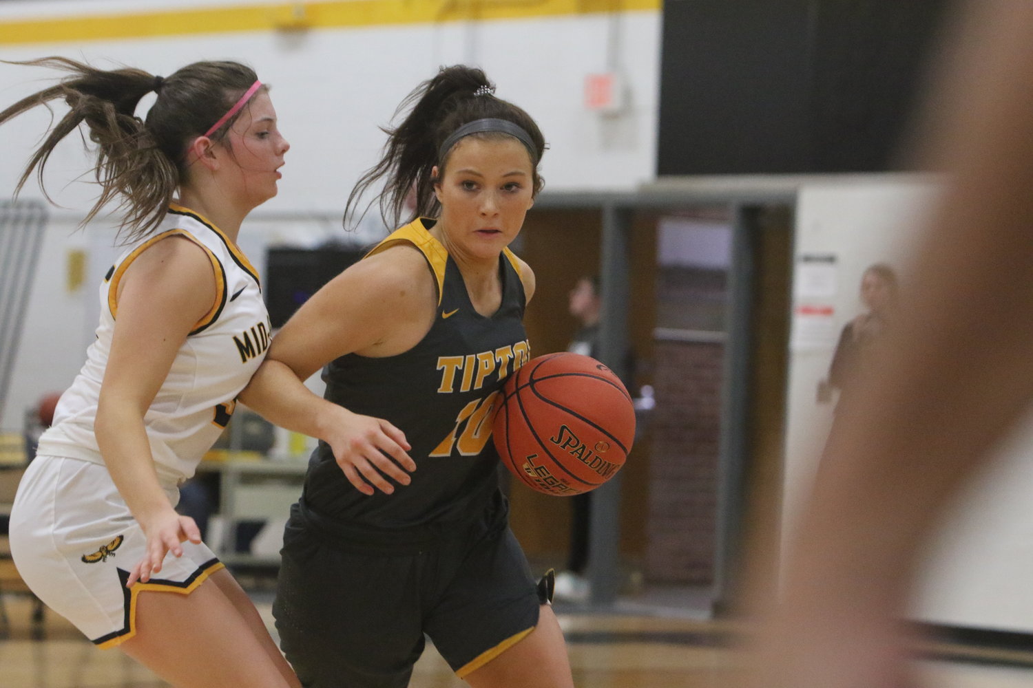 Mid-Prairie sophomore Nora Pennington, left, puts defensive pressure on Tipton's Brenna Wilkins in a game played December 3. Pennington had a career-high 7 steals in the Golden Hawks' 57-20 win.