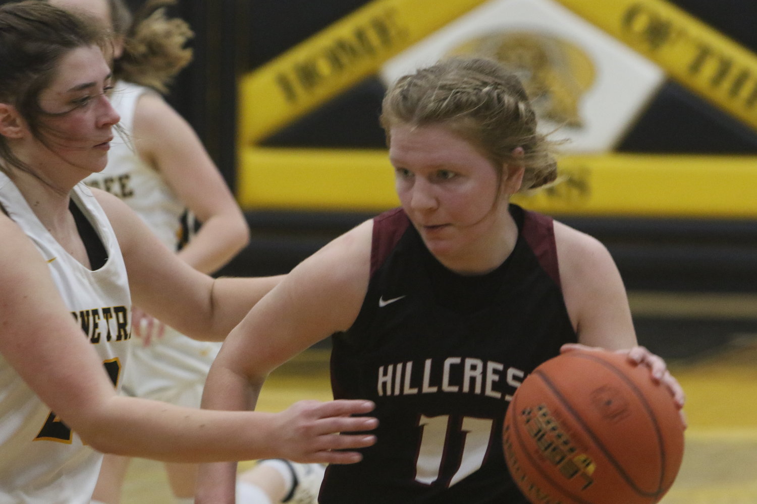 Hillcrest's Esther Hughes looks for a way around Lone Tree's Madelyn McCullough.