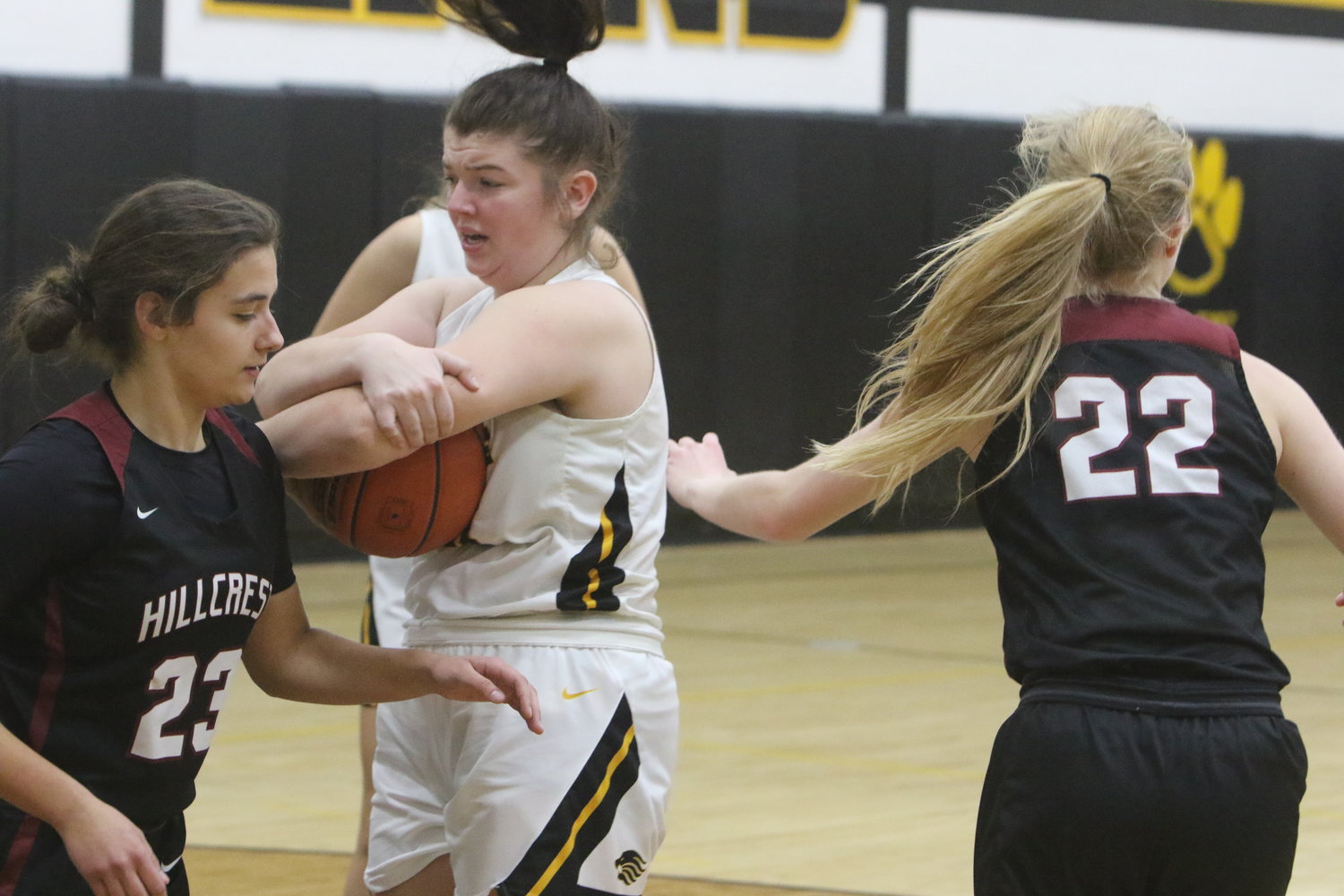 Bailey McGrew of Lone Tree holds on to a rebound.