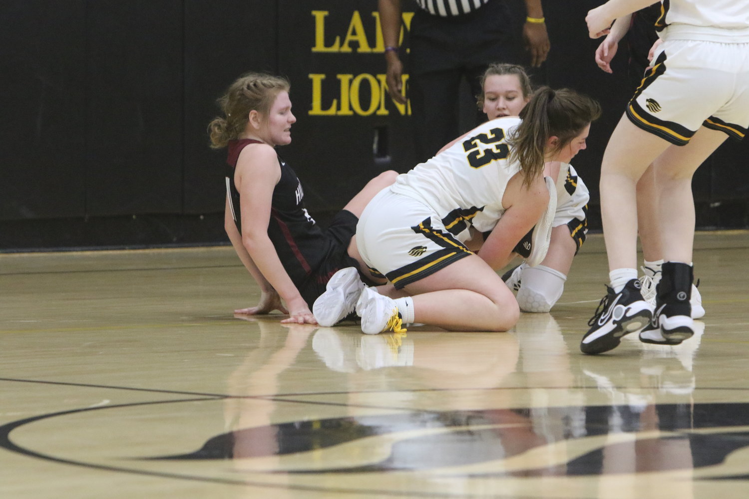 Madelyn McCullough of Lone Tree wins a scramble for the ball.