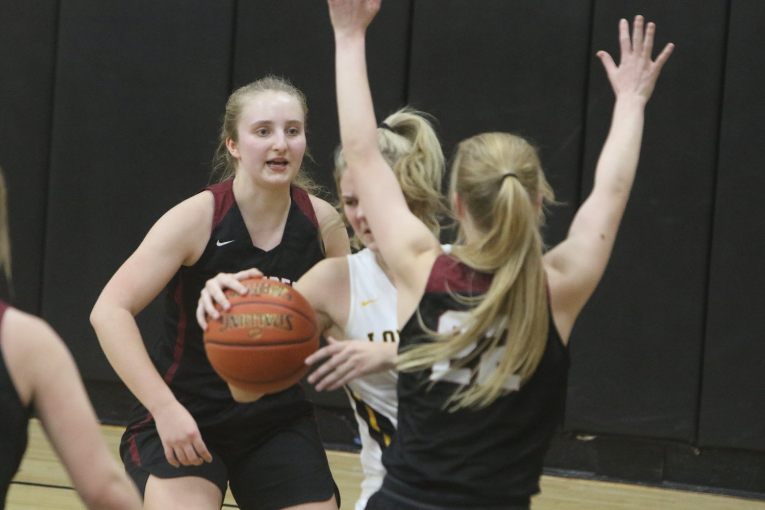 Hillcrest's Leah Bontrager tries to block Lone Tree forward Kasey Chown's path to the basket.