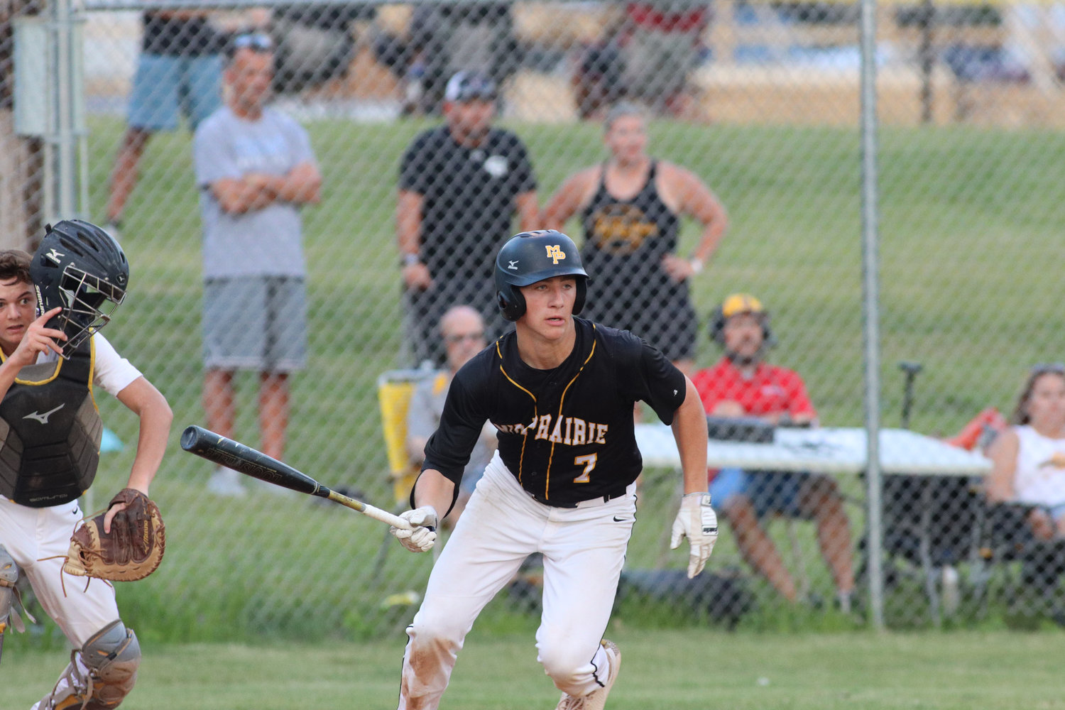 Karson Grout puts a ball in play during a Mid-Prairie win over Tipton on June 28, 2021.