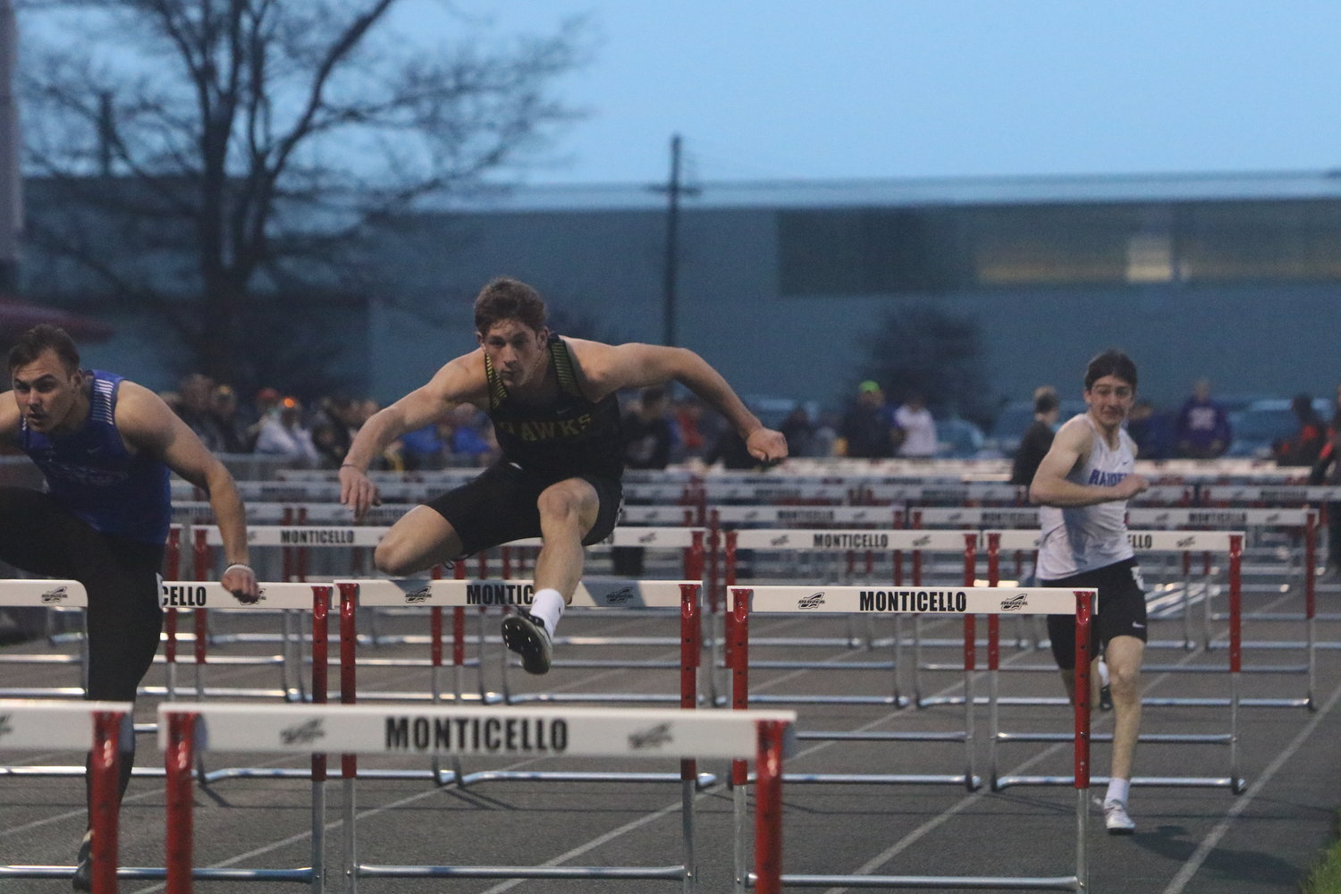 Cain Brown of Mid-Prairie leaps a hurdle in the 110 hurdle finals.