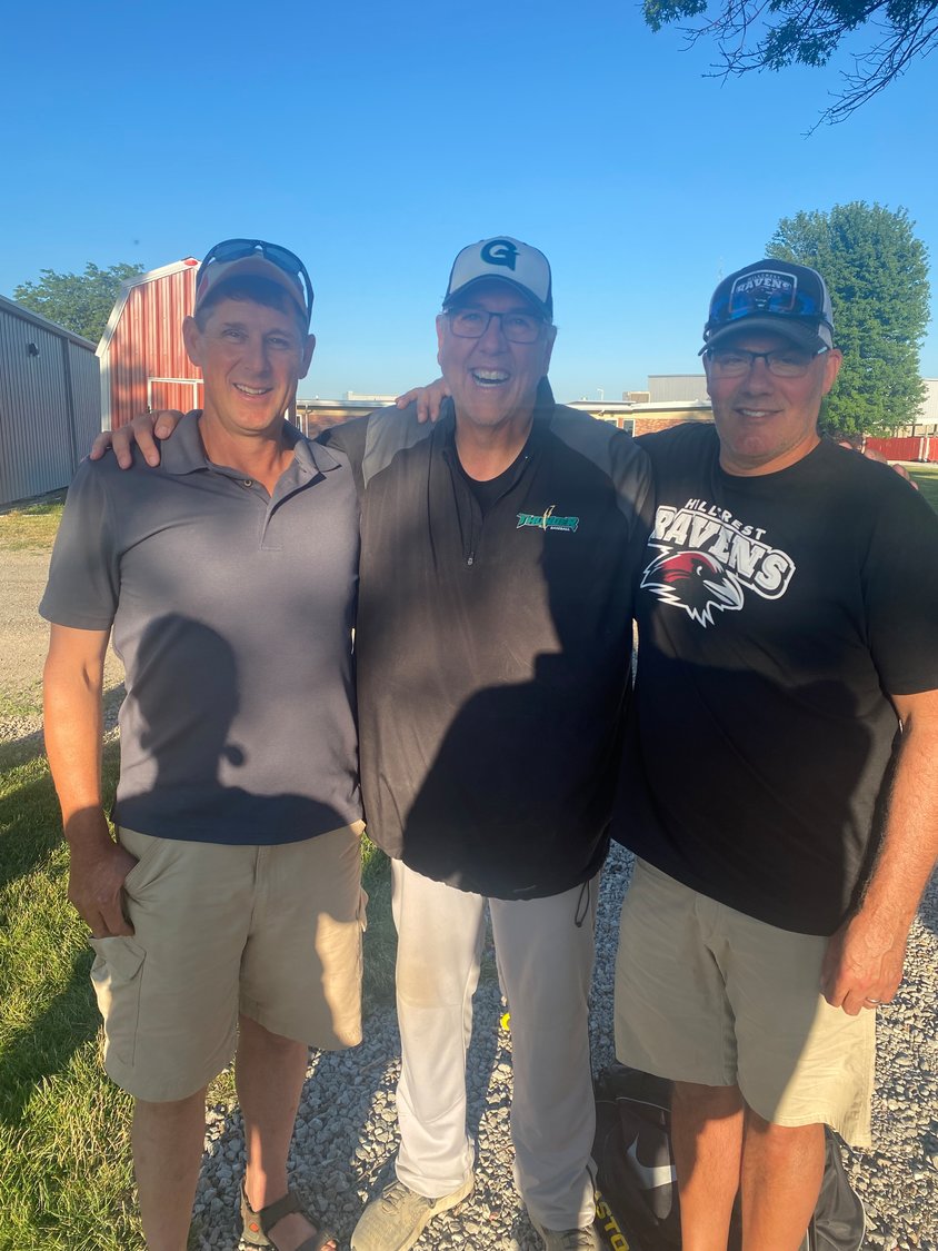 Grand View Christian assistant baseball coach Mark Felderman, center, reunites with his former Iowa Mennonite School players Leon Schrock and Jon Beach, fathers of current Hillcrest Academy baseball players. Felderman coached Schrock and Beach in the first year of IMS baseball in 1985.