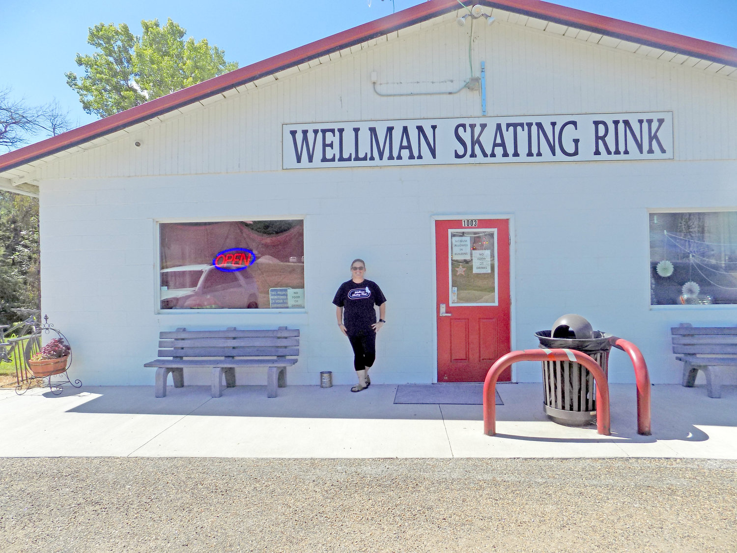 Manager Brenda Reasor wears a shirt bearing a glow-in-the-dark Wellman Skating Rink logo that she designed.