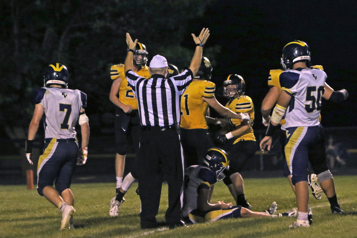 The Lions celebrate Joe Boxwell's fumble recovery for a touchdown during Lone Tree's 49-24 win over English Valleys.