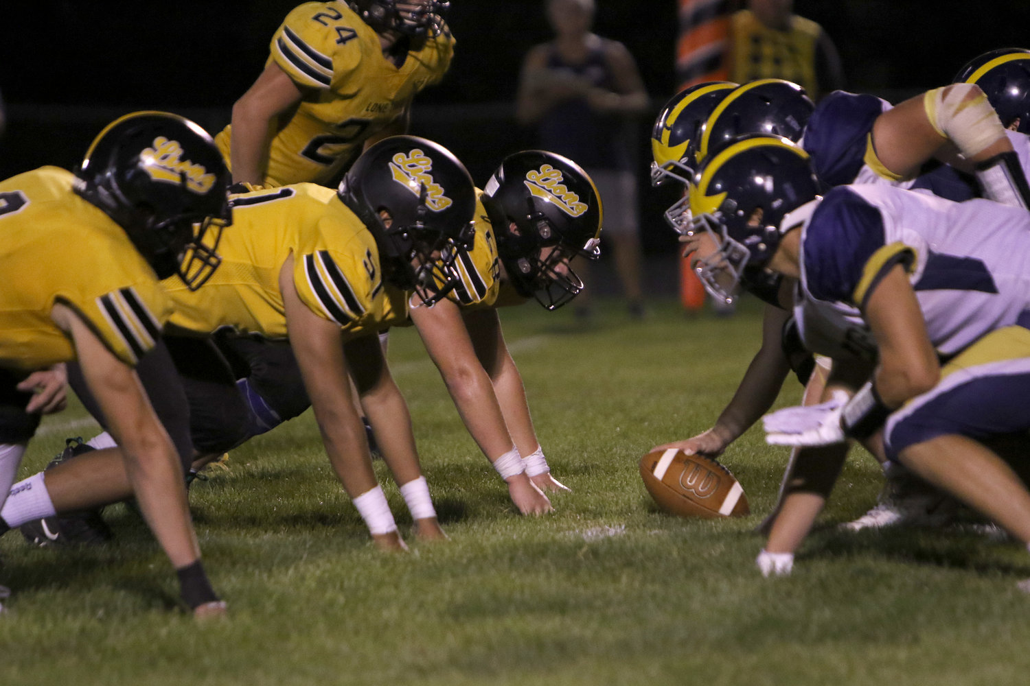 The Lion defensive line waits on the snap during Lone Tree's 49-24 win over English Valleys.