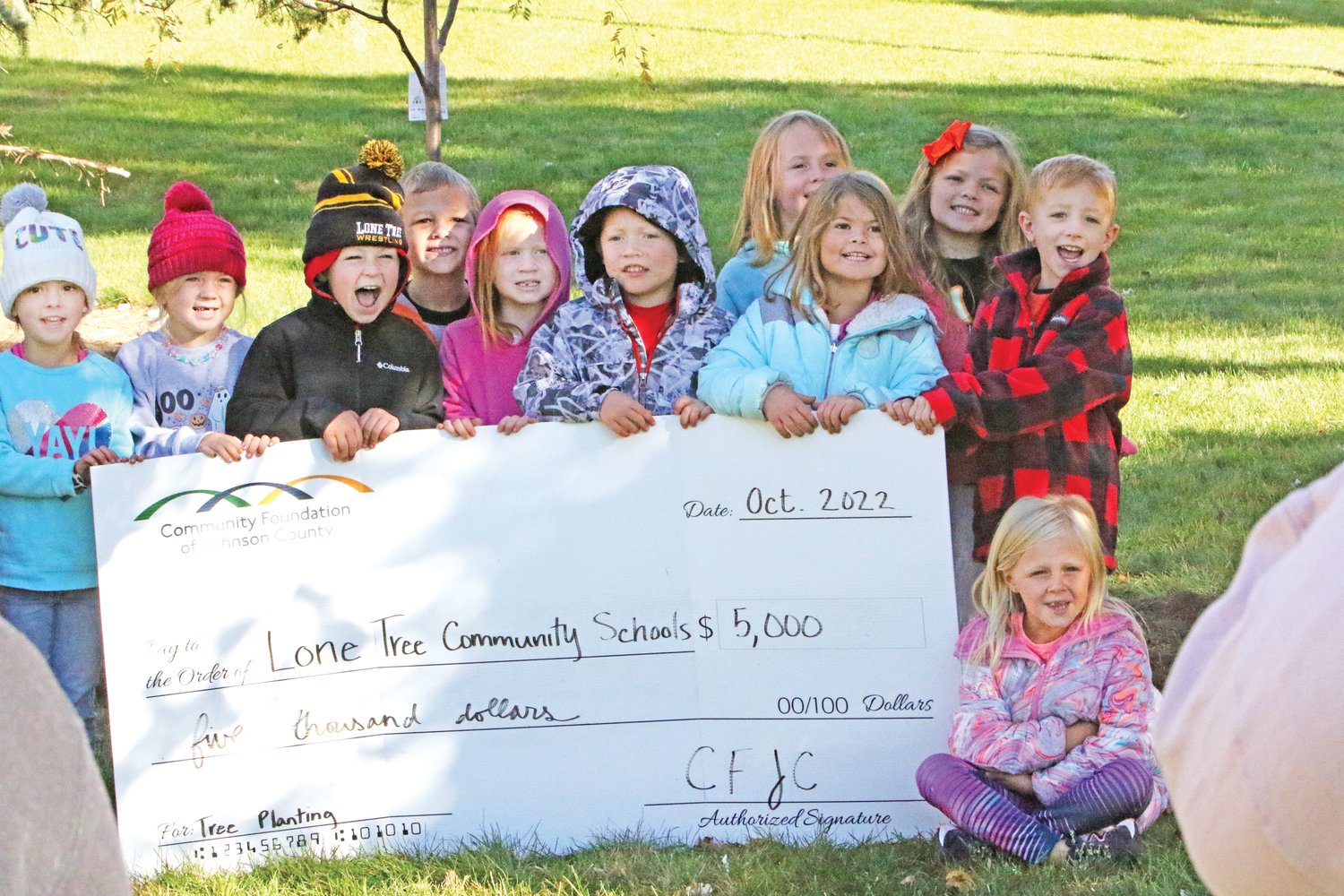 Lone Tree Elementary Students smile with half of the grant money provided by the Community Foundation of Johnson County.