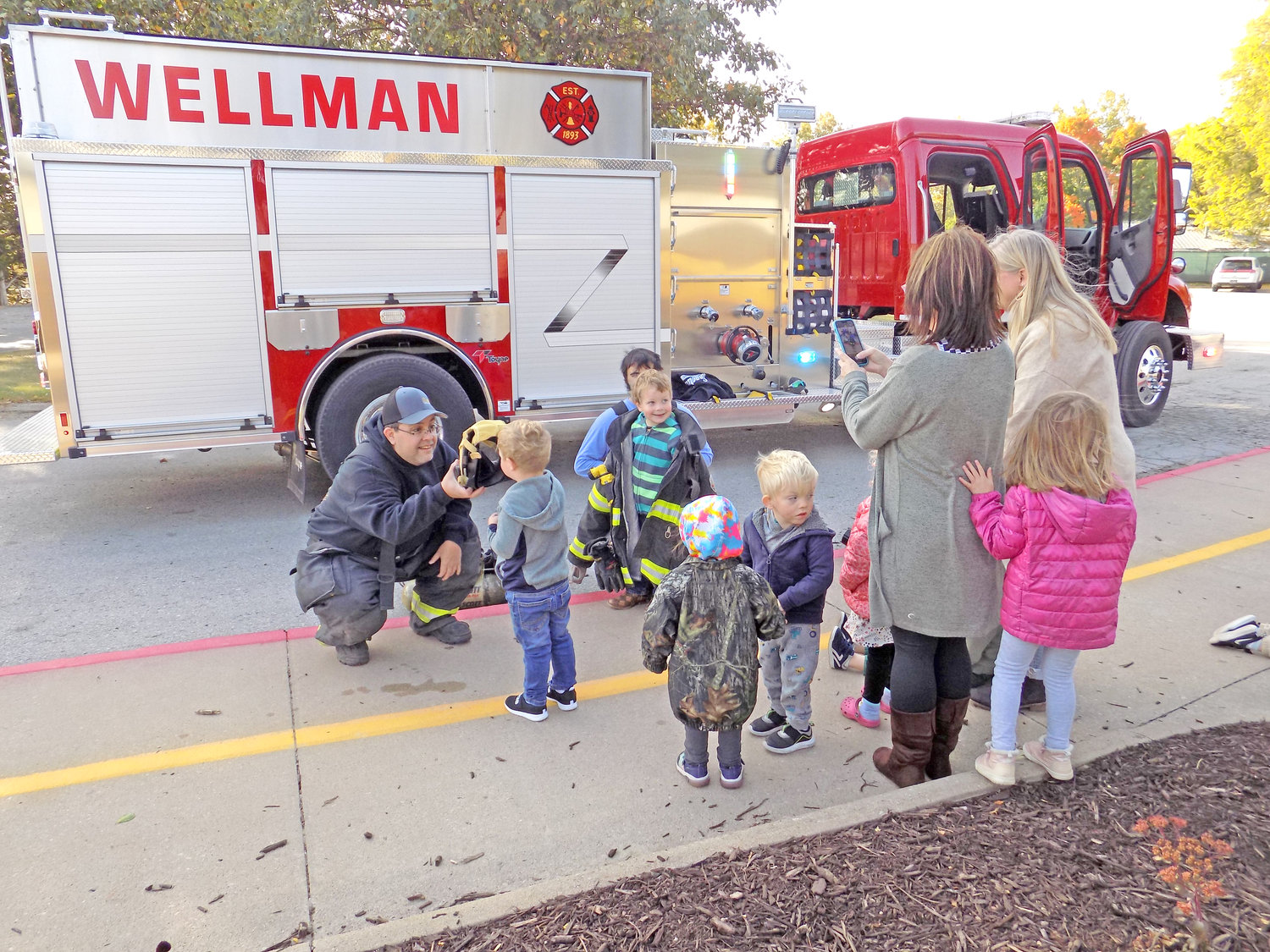 Wellman volunteer firefighters Tony Rios and Stone Peck visited M-P West Elementary on Oct. 13 with their new pumper truck.