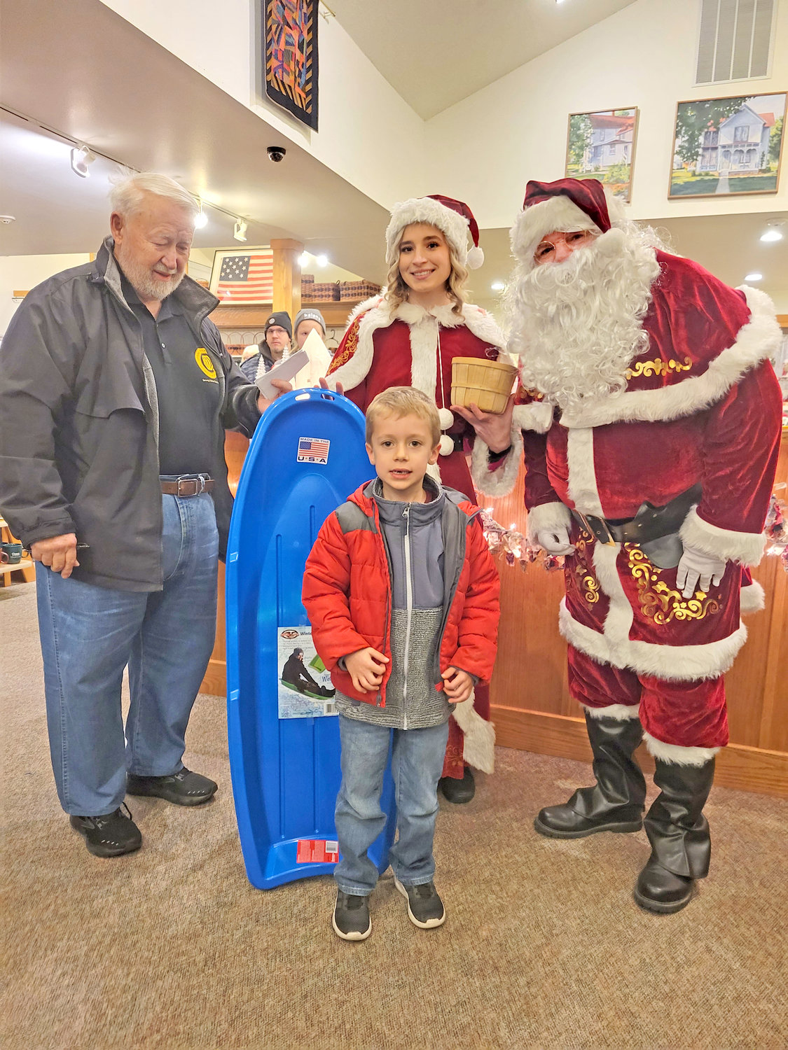 Hudon Helmuth, son of Anthony and Shaina Helmuth of Kalona, was the winner of the blue sled given away by the Kalona Optimists.