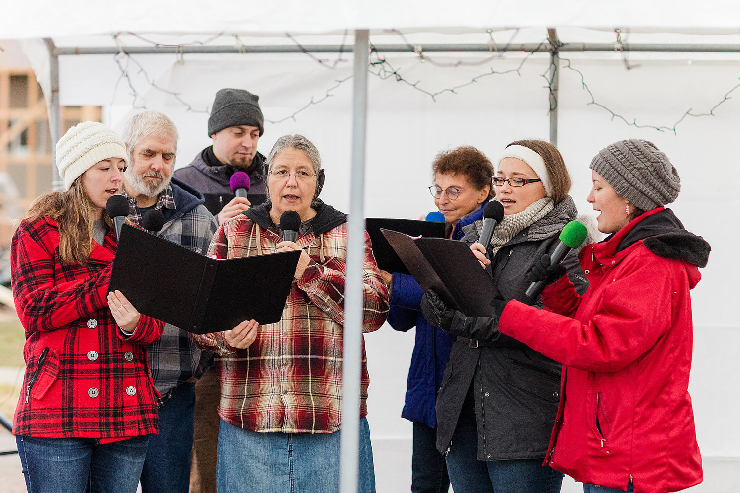 Nate Nisly’s singing group filled the air with caroling while attendees enjoyed cookies and hot chocolate provided by DJ’s Casual Café.
