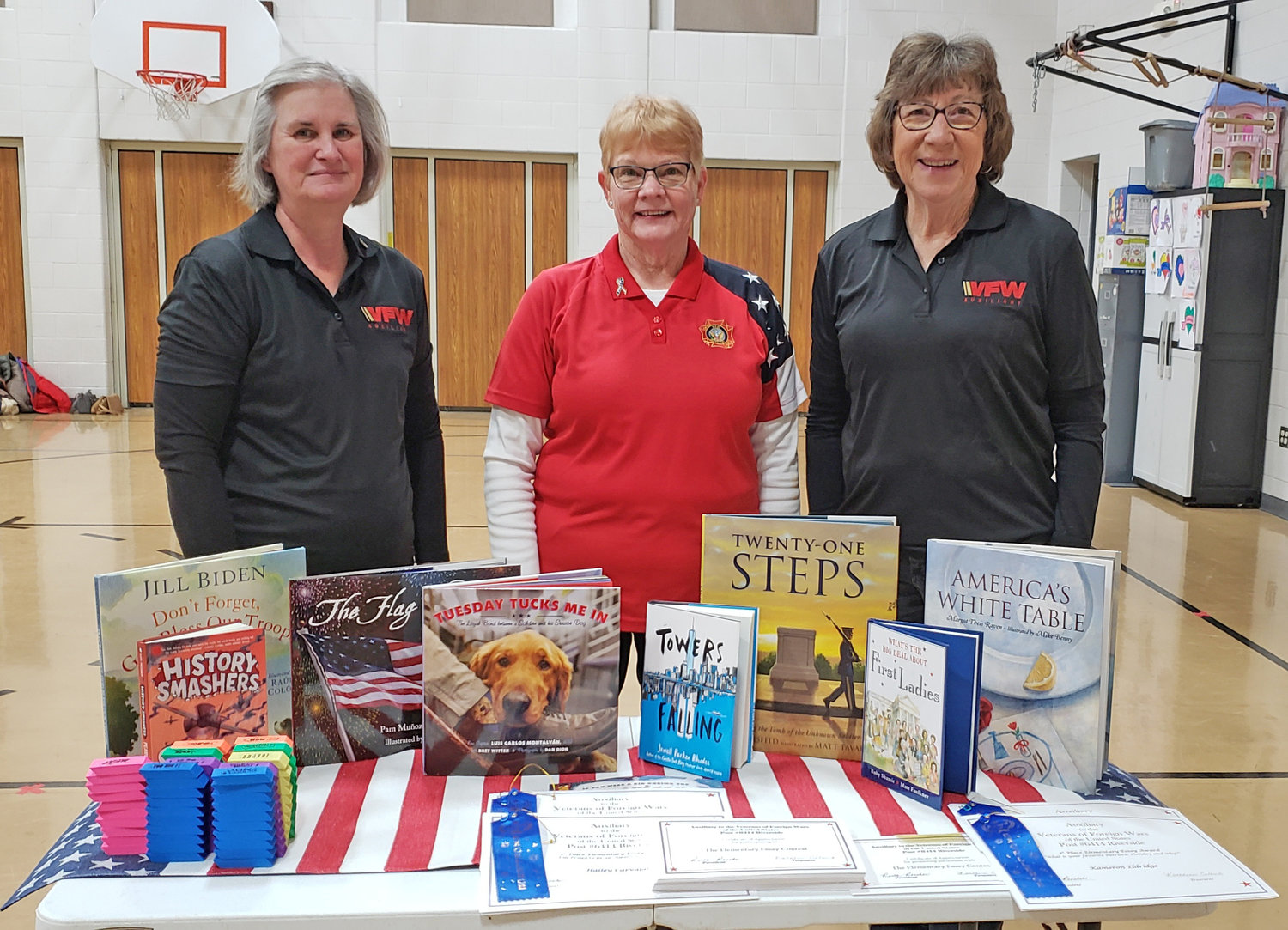 The Auxiliary donated books to the Highland Elementary School library as part of their “Patriotism Through Literacy” project.  L-R:  Auxiliary Treasurer Kathy Colbert, President Ruth Rencher and Secretary Kathy Schreiber.