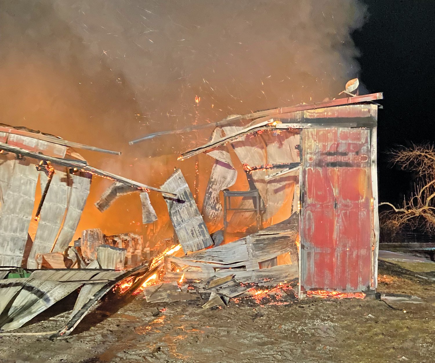 A machine shed and its contents were completely destroyed by fire on Saturday night.