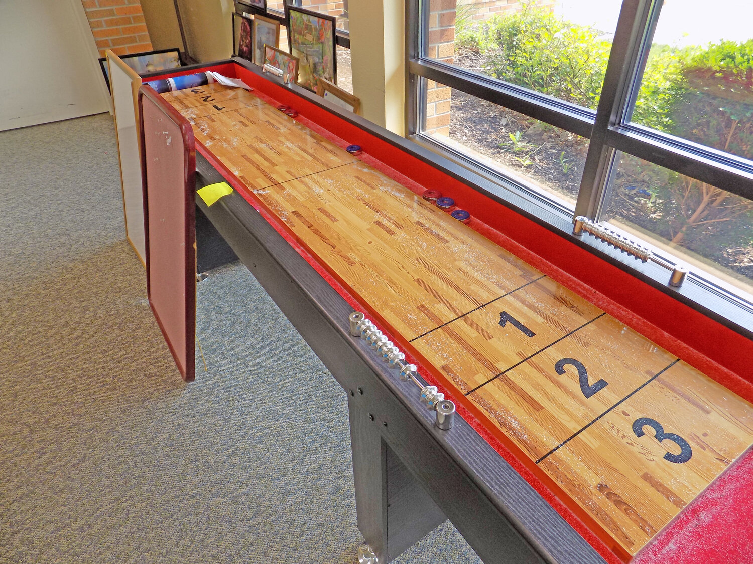 A shuffleboard was an early seller at the yard sale.