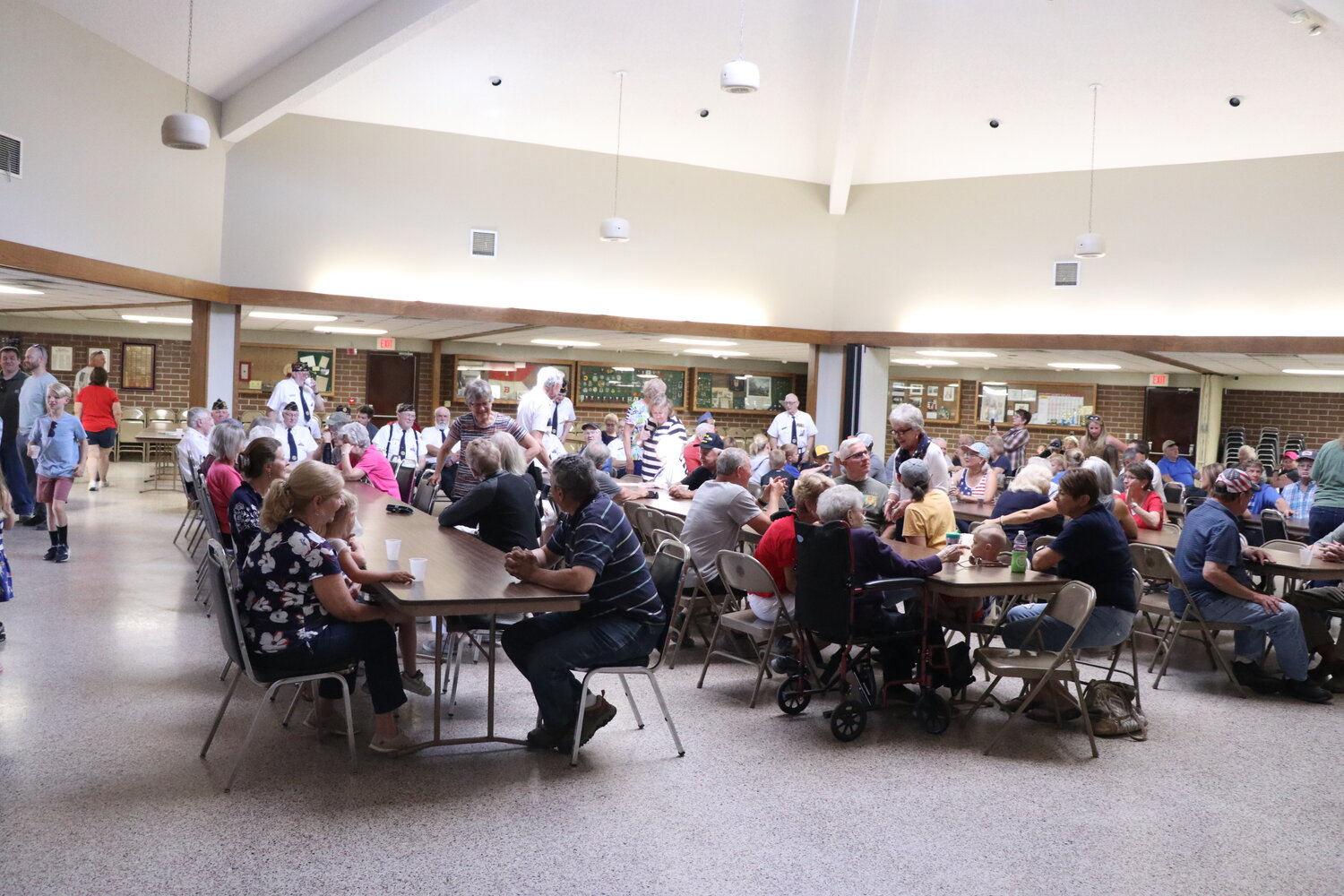 Lone Tree residents pack the American Legion to enjoy donuts and other treats before the Memorial Day speakers arrive at the podium.