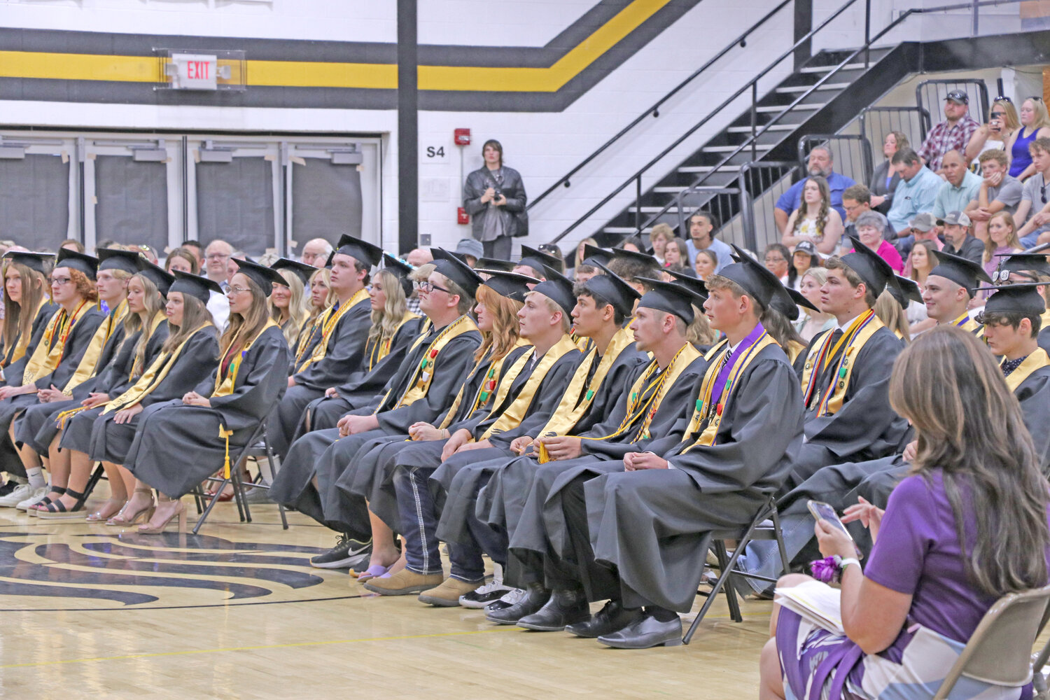 The Lone Tree class of 2023 listening to speakers such as superintendent Kurt Devore, high school principal Andrew Koshatka and the teacher of their choosing, Mick Dickinson.