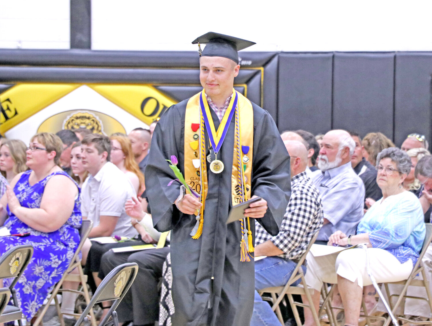 Lone Tree graduate Braden Viers looks for his family after walking the stage and receiving his diploma from his father, Gordon Viers, a member of the school board.