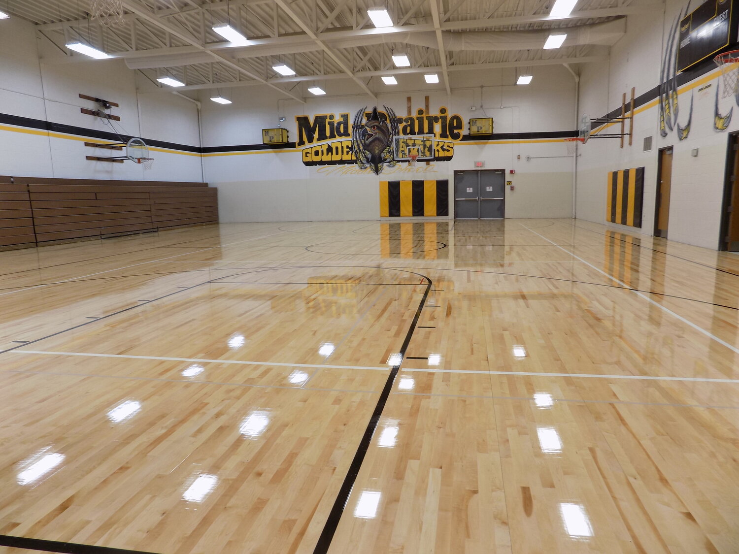 A brand-new, high-gloss floor in Mid-Prairie’s Middle School gym is ready for action.  Last year the gym’s floor was badly warped and damaged by a water leak in the boy’s locker room.