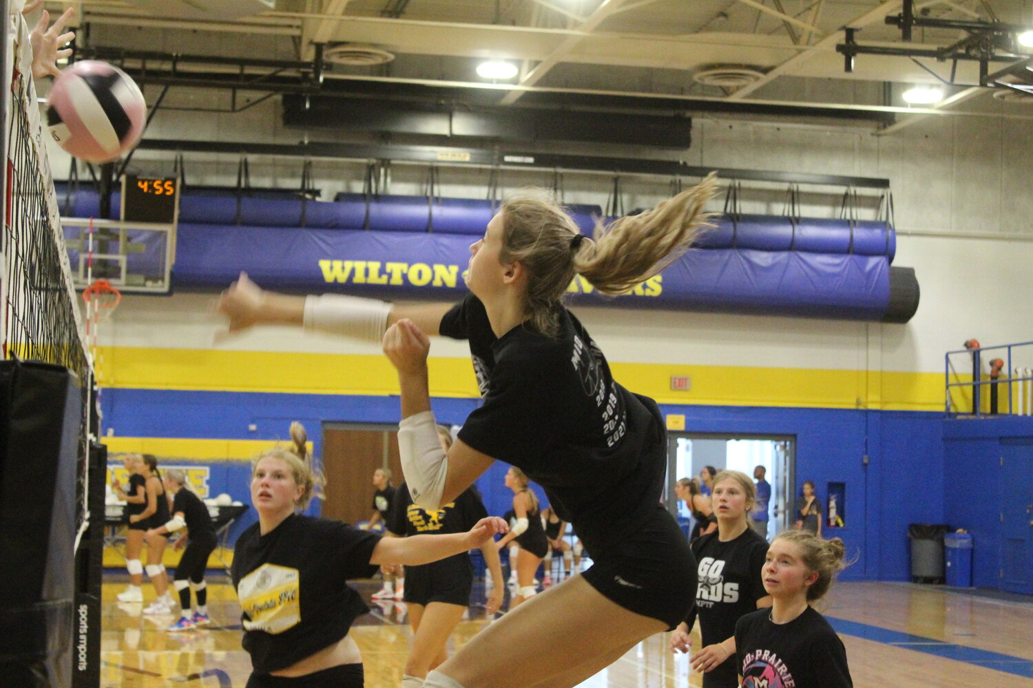 Paige Safly of Mid-Prairie goes up for a spike.