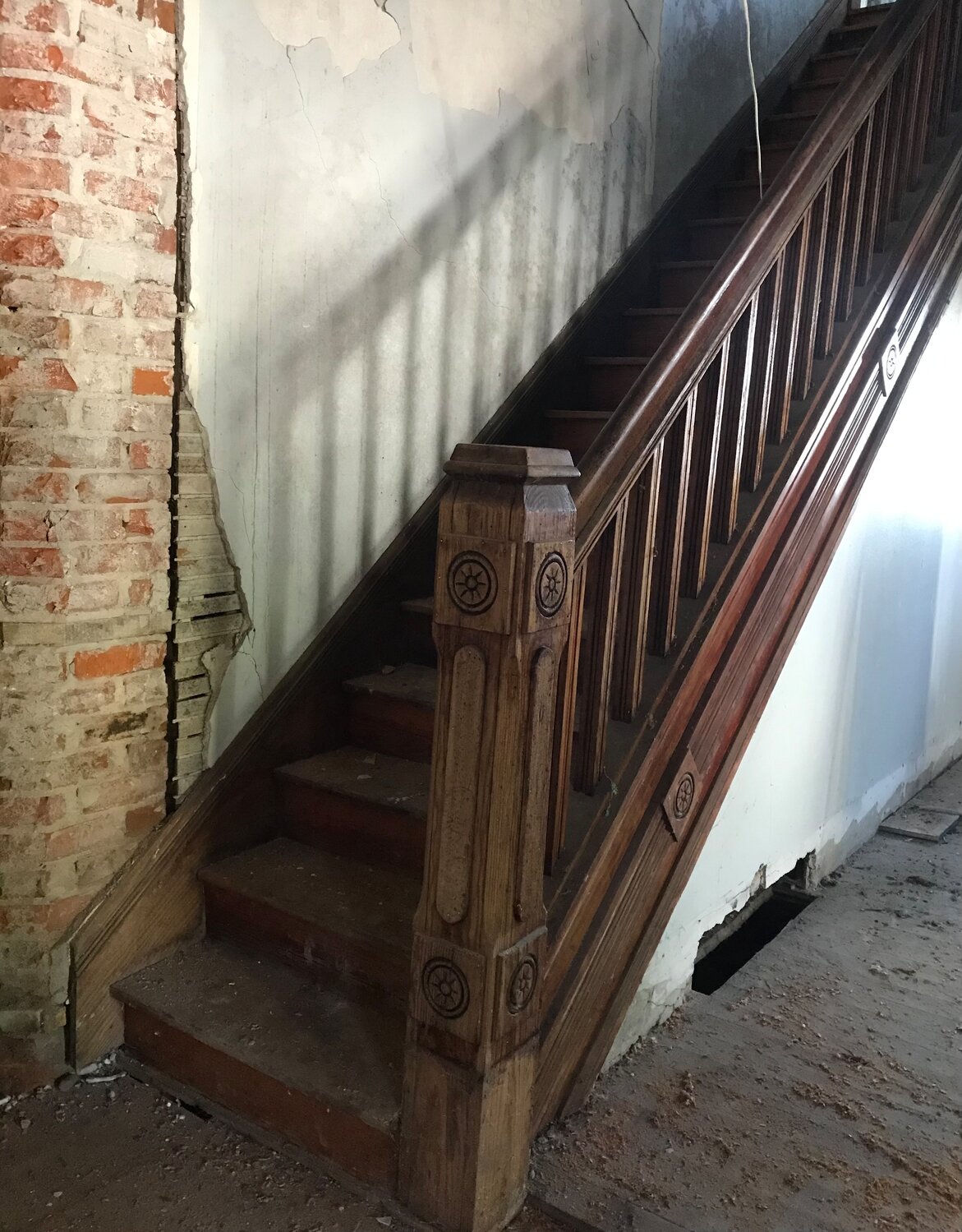 The carved, solid wood staircase is still in place and ready for another 100 years.