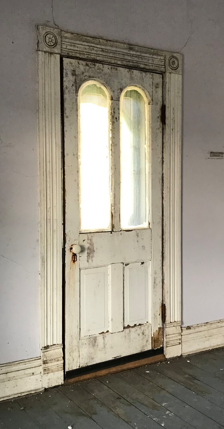 Many of the old doors and woodwork have been preserved despite the extensive cleanup and mold removal that was required.