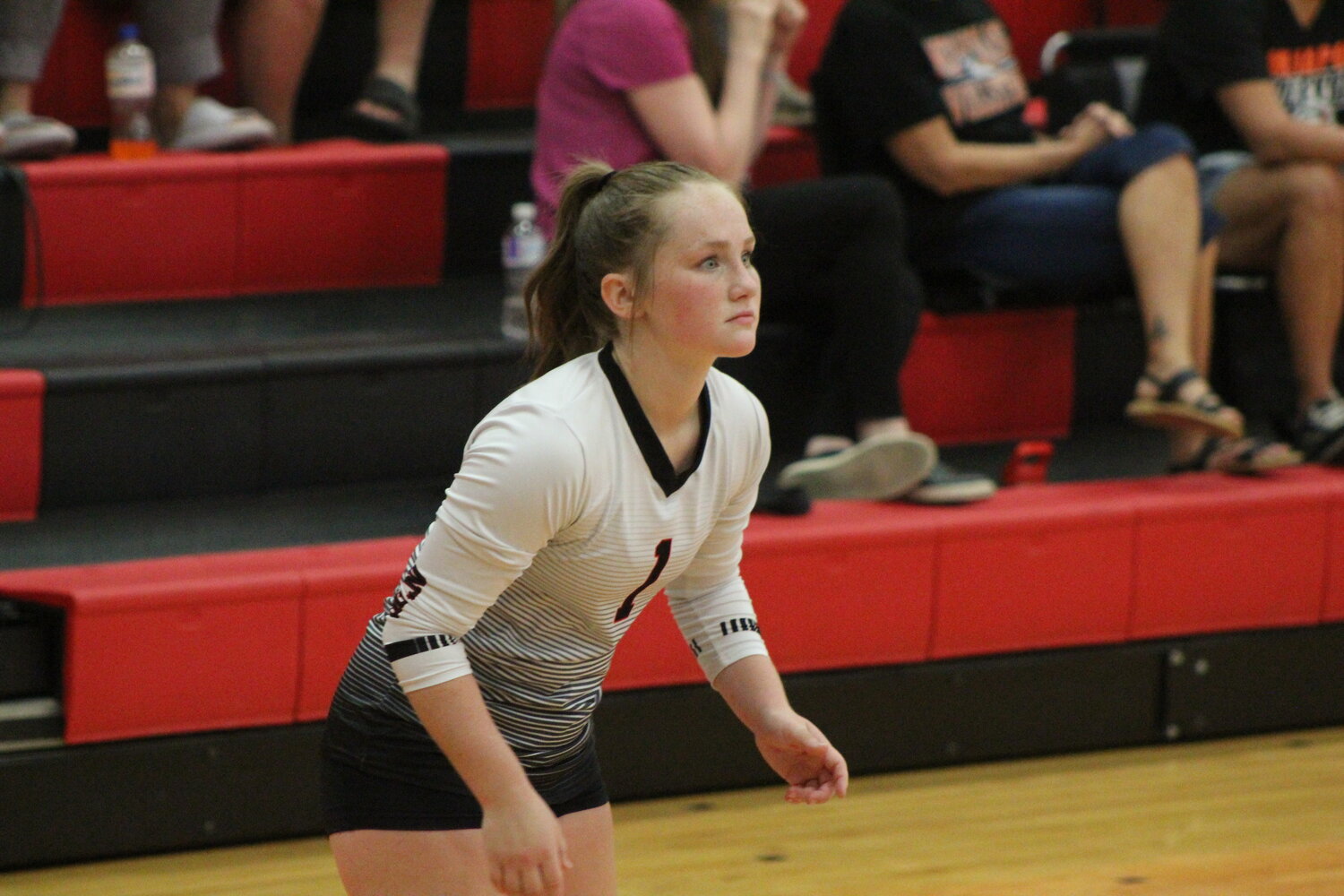 Highland libero Madison Beeson sets up for a return in an SEISC Tournament match against Pekin.