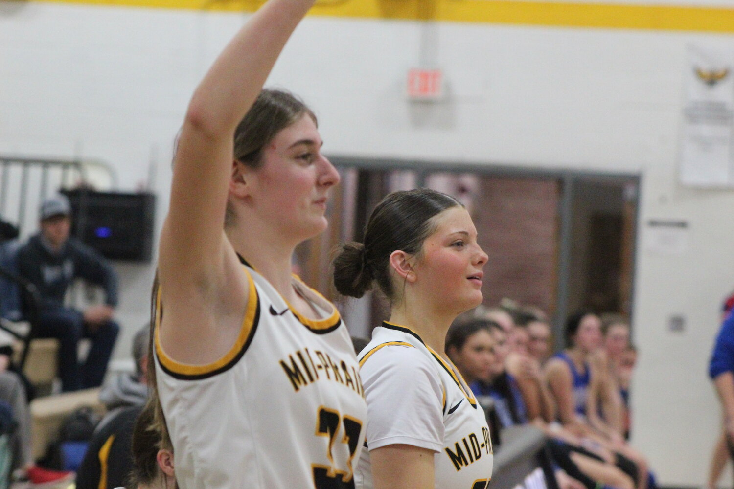 Mid-Prairie's Nora Pennington, right, and Morgyn Bender celebrate the final seconds of the Golden Hawks' victory Saturday against Albia.